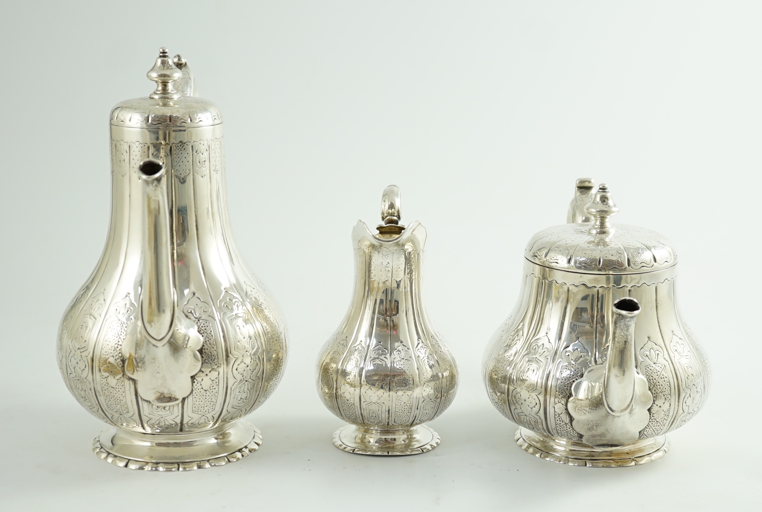 A Victorian silver three piece coffee set, comprising pot, cream and sugar bowl, by Walter Morrisse